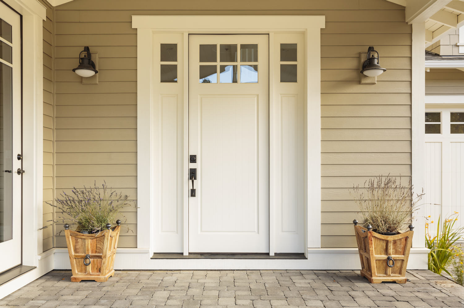 White,Front,Door,With,Small,Square,Decorative,Windows,And,Flower